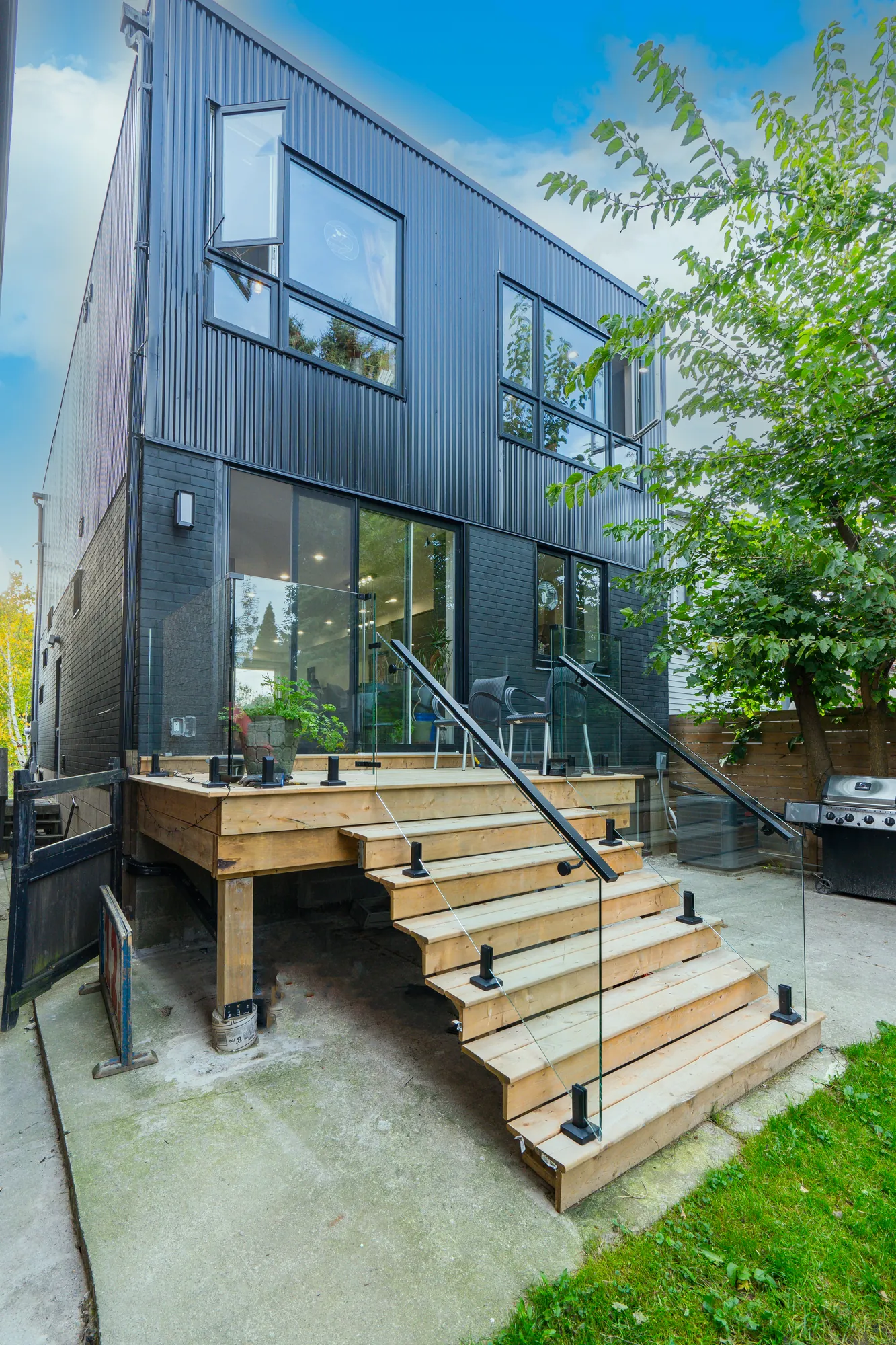 The full height of the deck, stairs and glass railing on the Ajax build