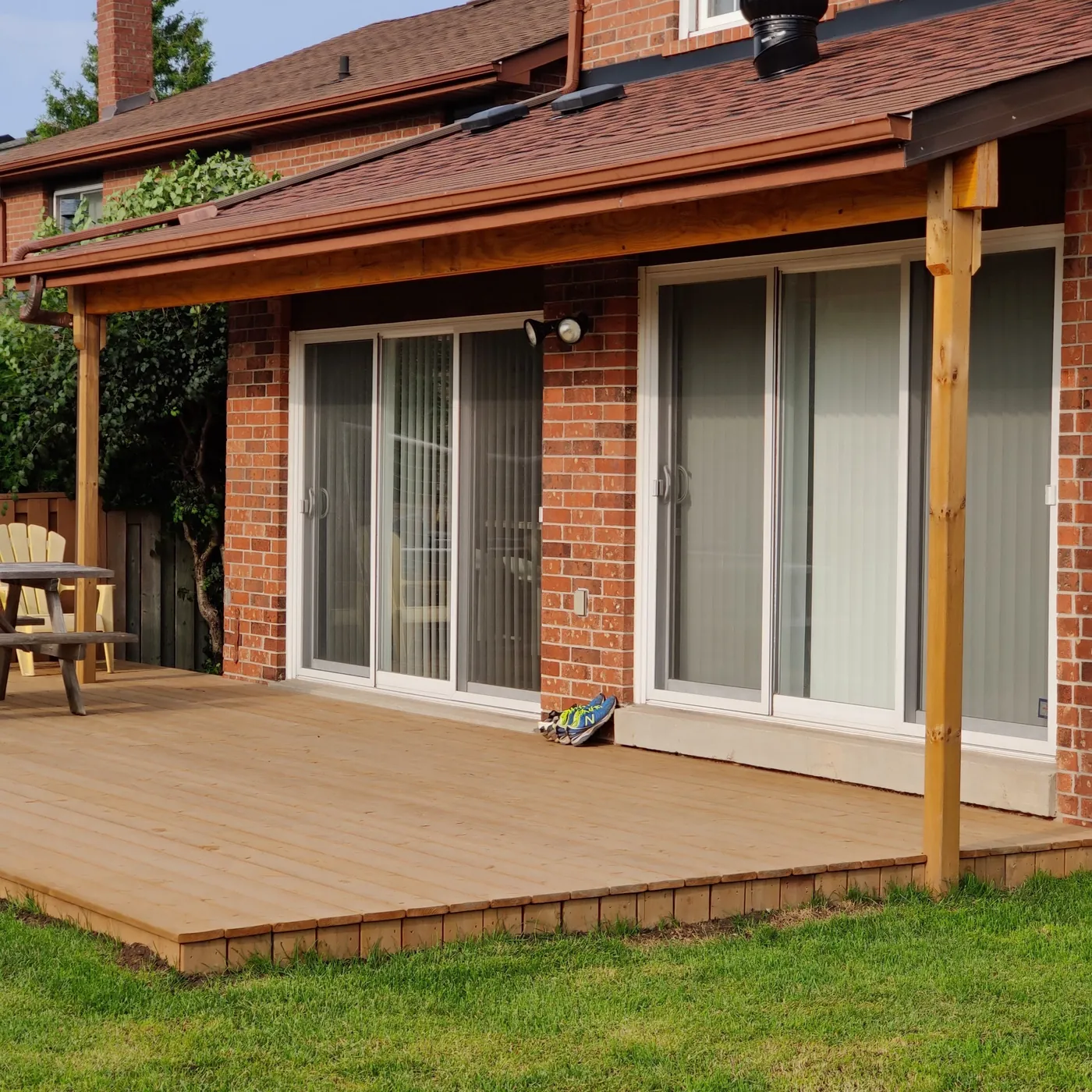 The covered deck and its timber posts from the side, Aurora