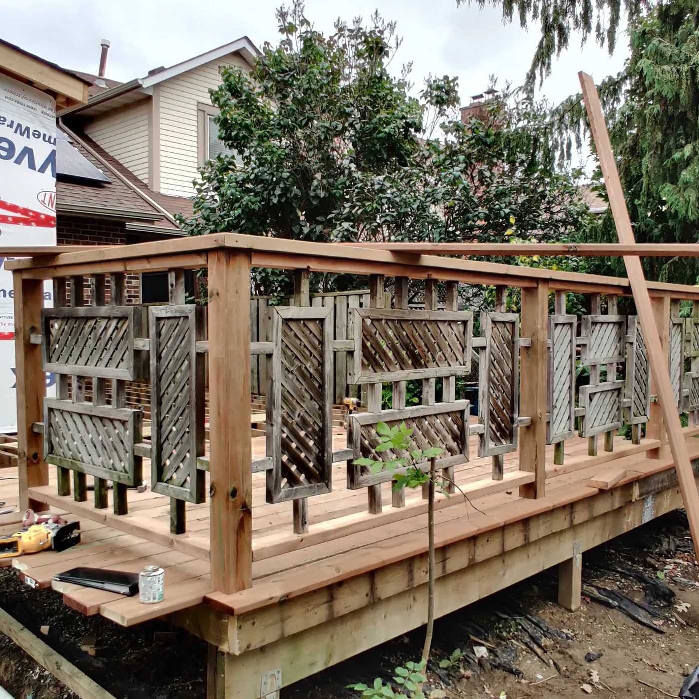 New deck framed and railed while the house was being re-clad, Brampton