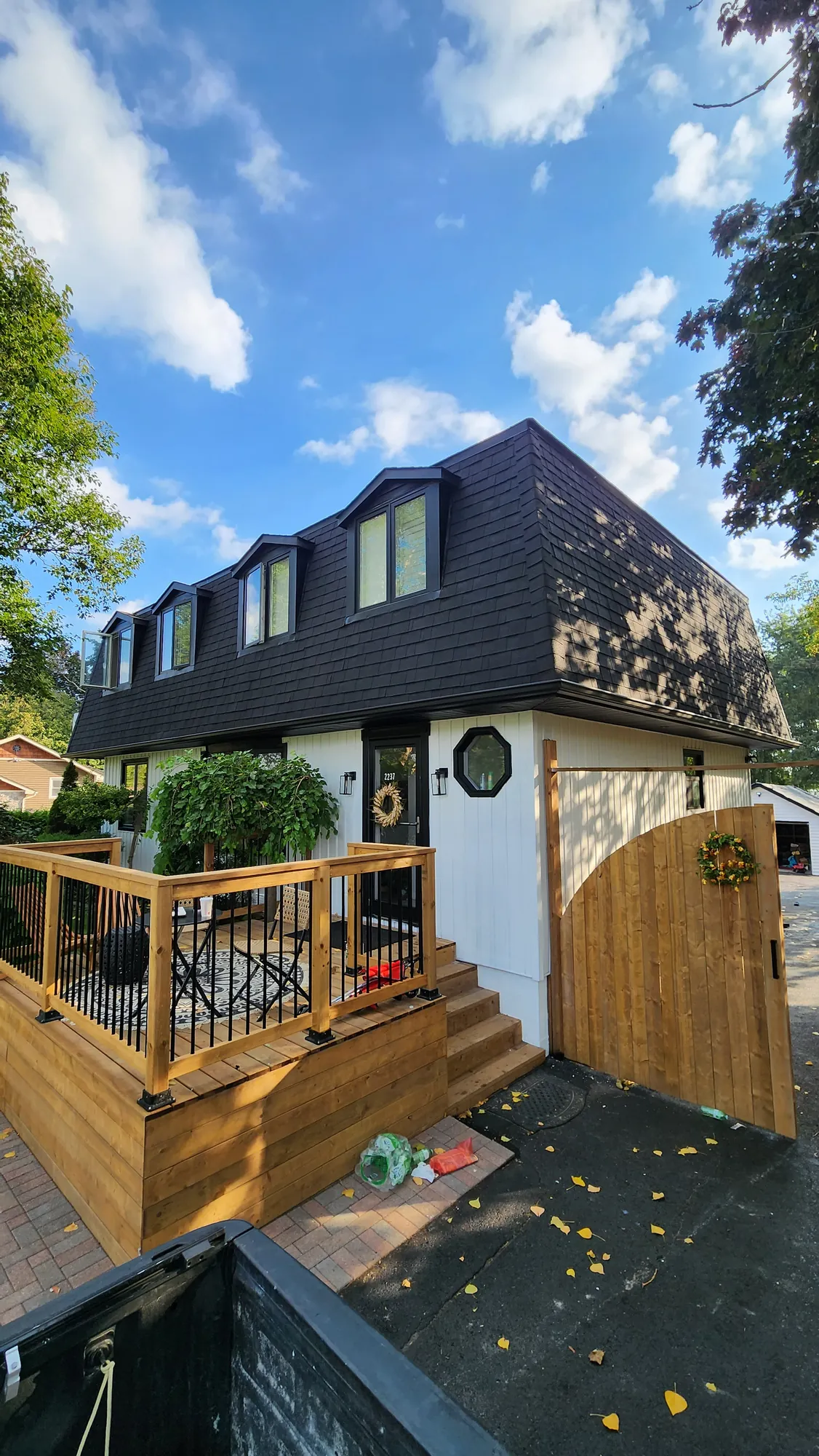 The porch deck and railing from the side of the driveway, Clarington