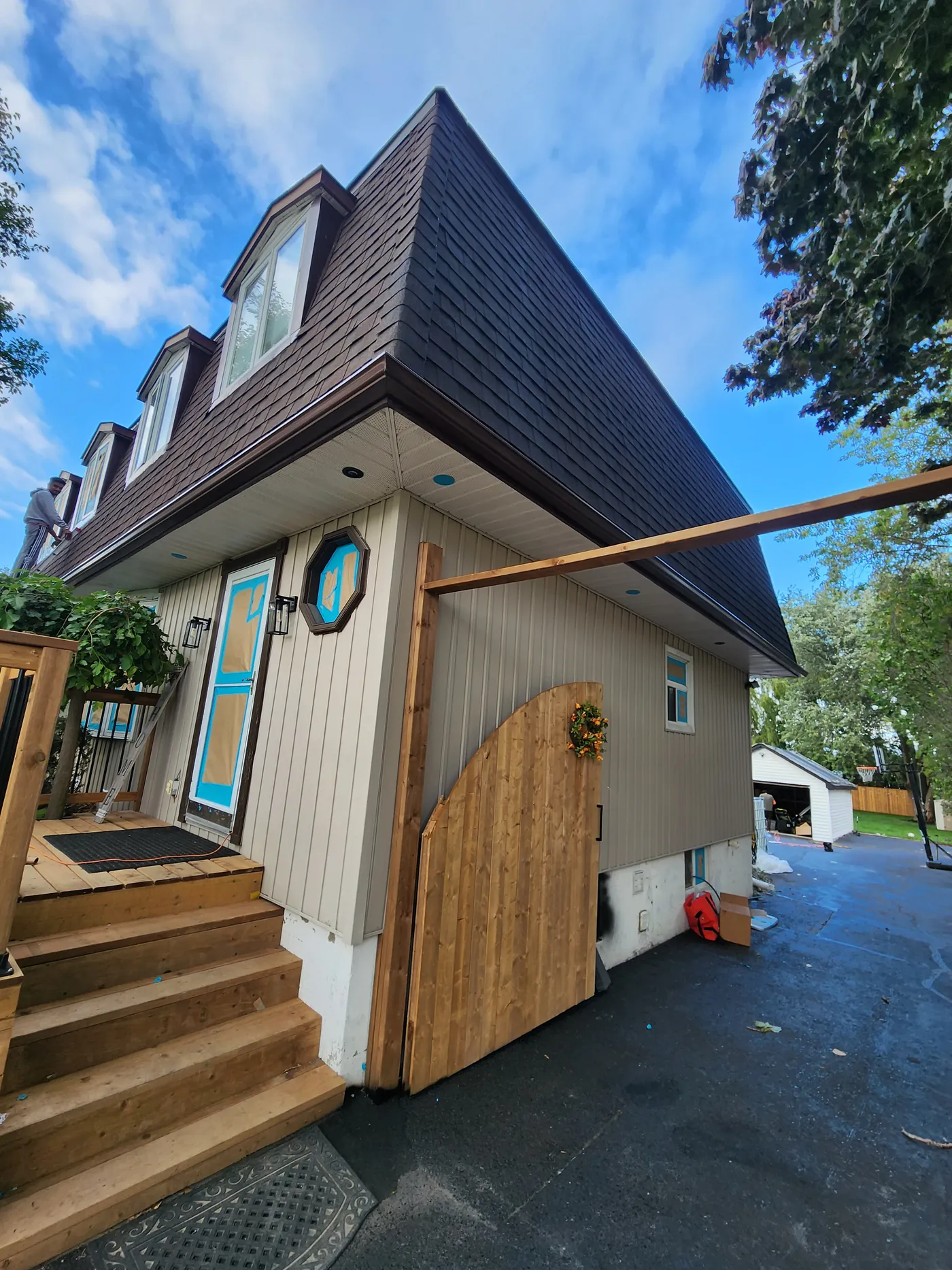 Stairs up to the porch and the arched privacy gate closing off the side, Clarington