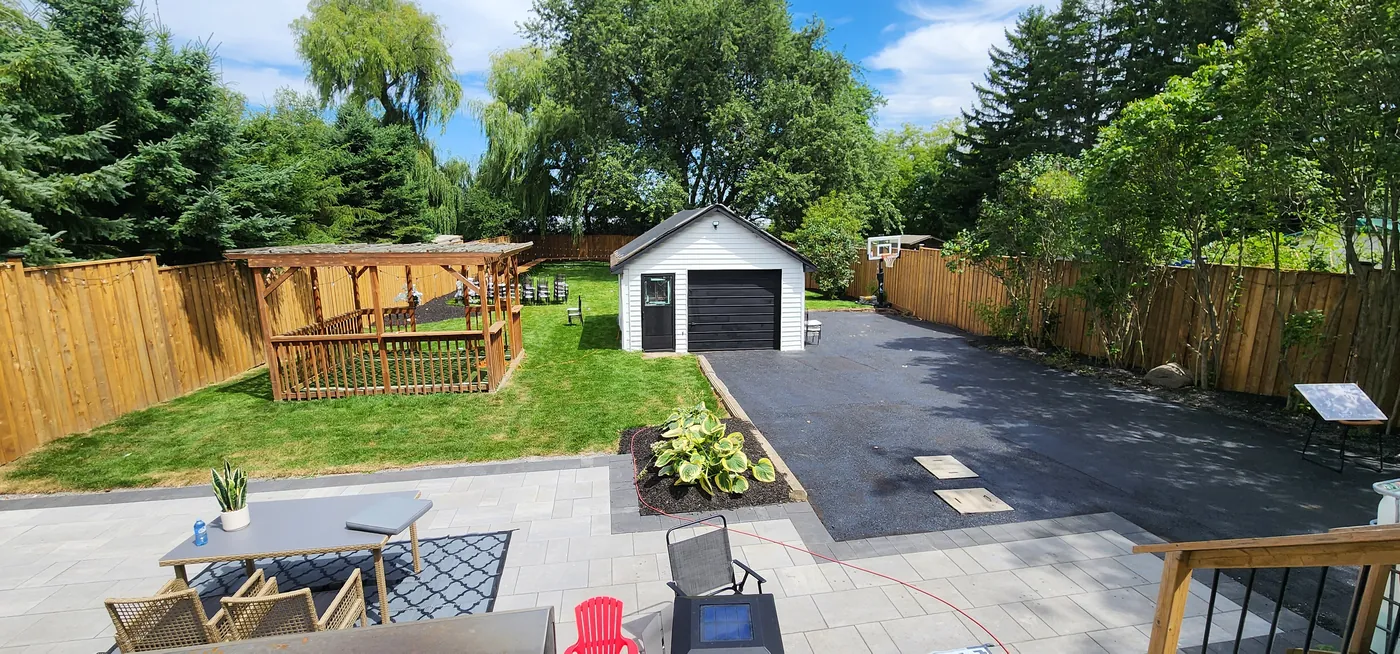 7 ft pressure-treated privacy fence enclosing the full backyard of a Clarington property