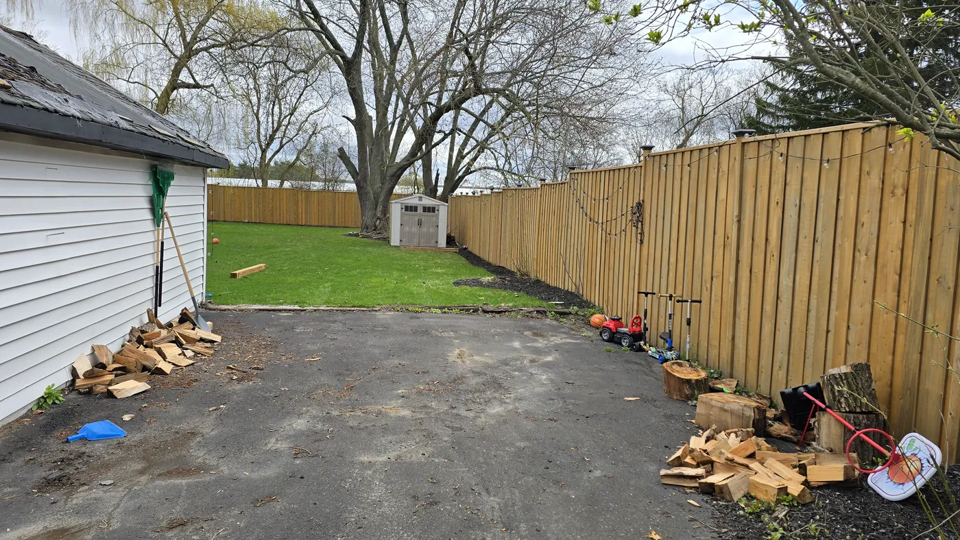 The finished fence running past the garage to the rear of the lot, Clarington
