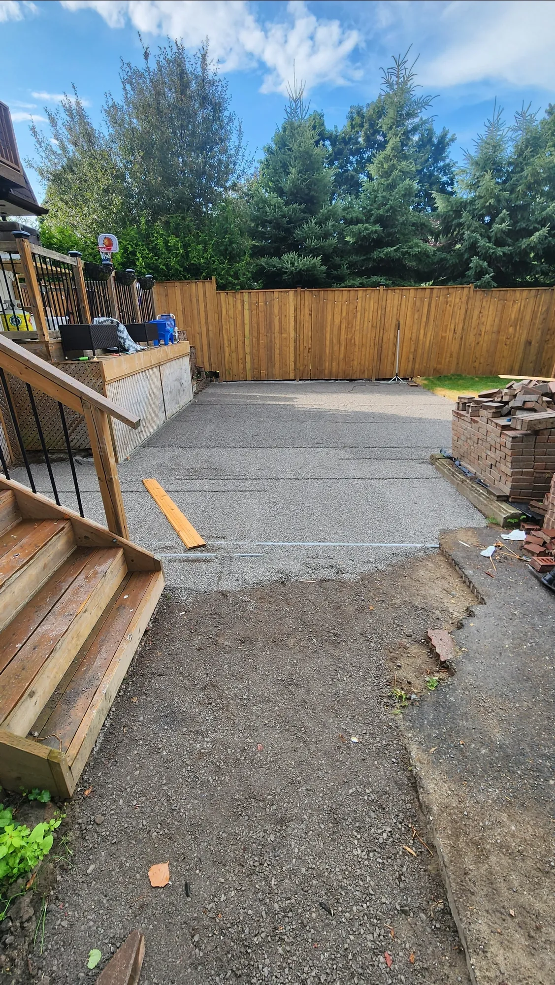The new fence in place while the rest of the yard was still being rebuilt, Clarington