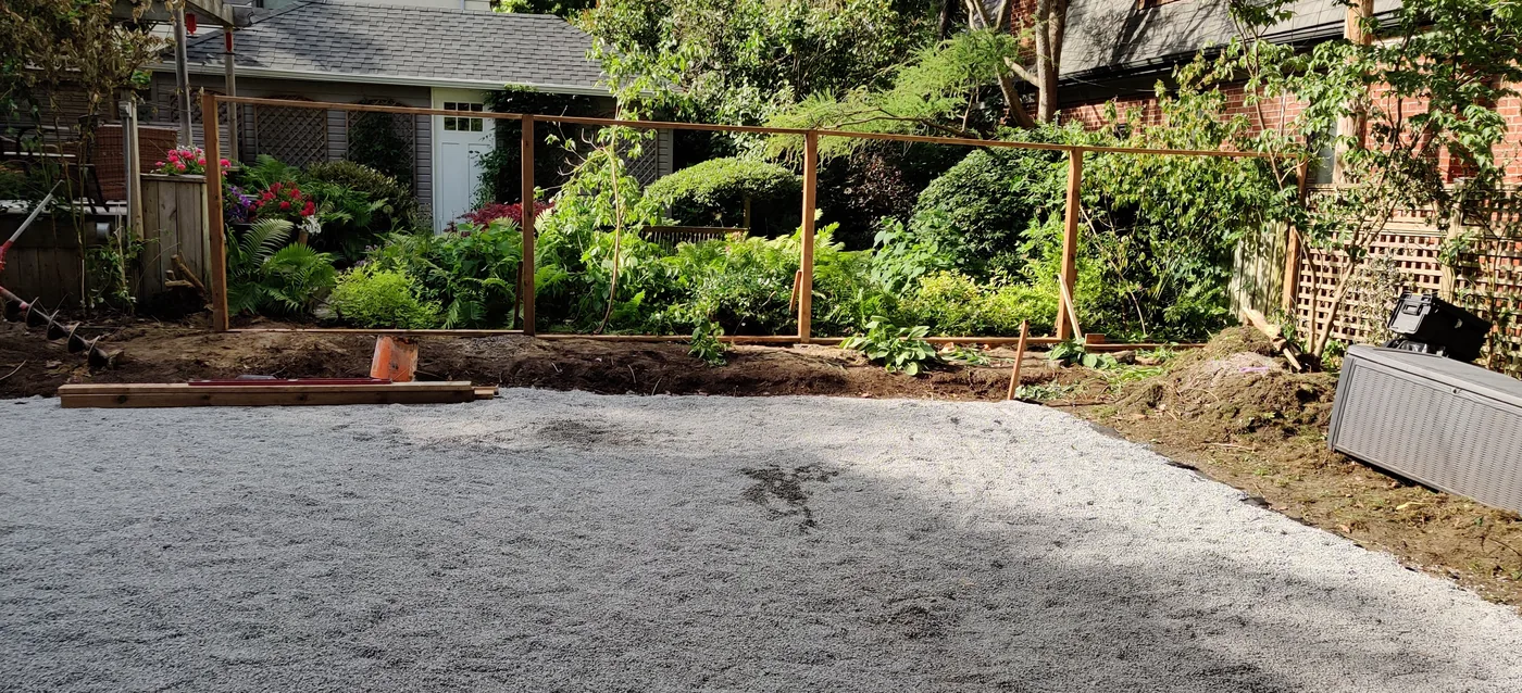 Compacted gravel base laid for the patio inside the new East York fence
