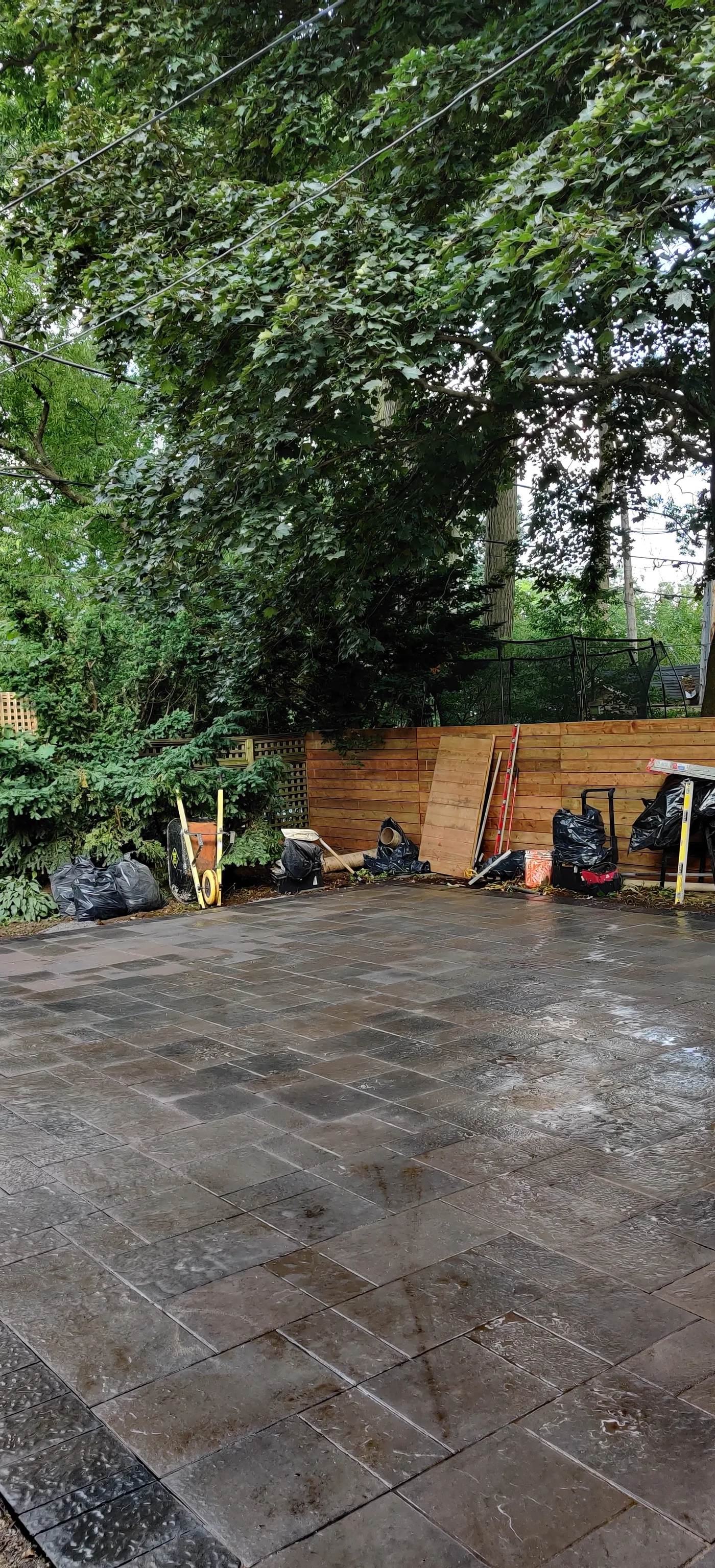 Pavers going down on the prepared base in the East York backyard