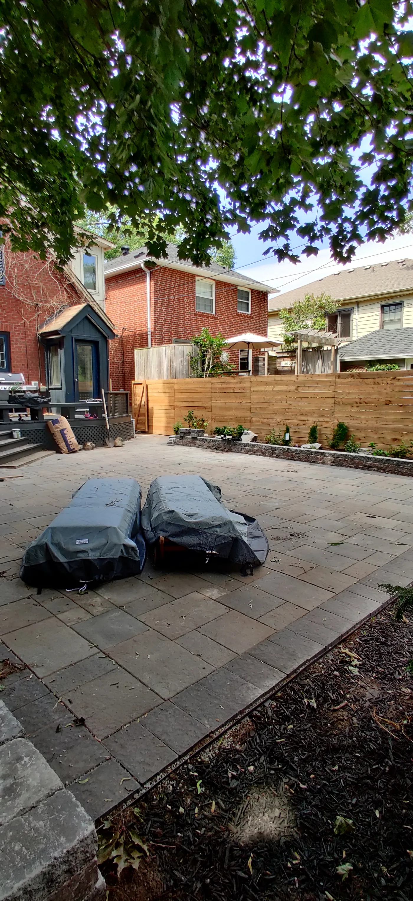 Finished privacy fence and gate beside the patio in East York