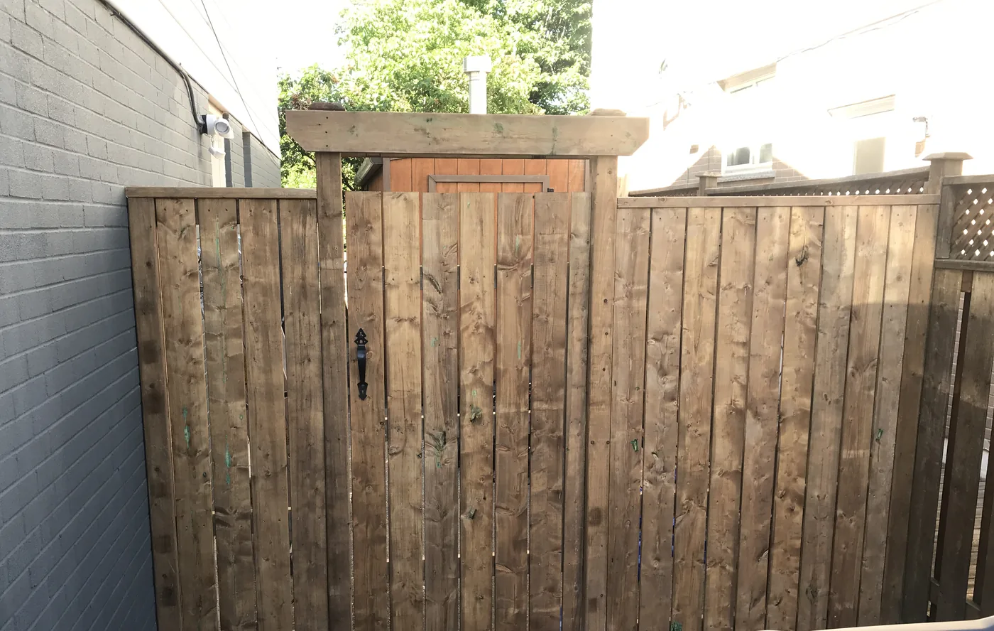 Rebuilt gate and fence panels after the old posts were found rotten, Etobicoke