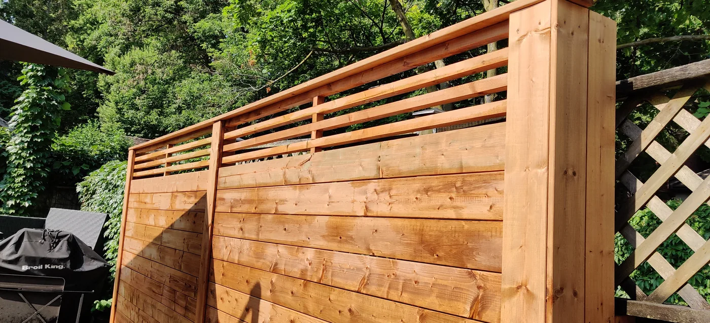 Open slat top section above the horizontal boards on the King City privacy fence