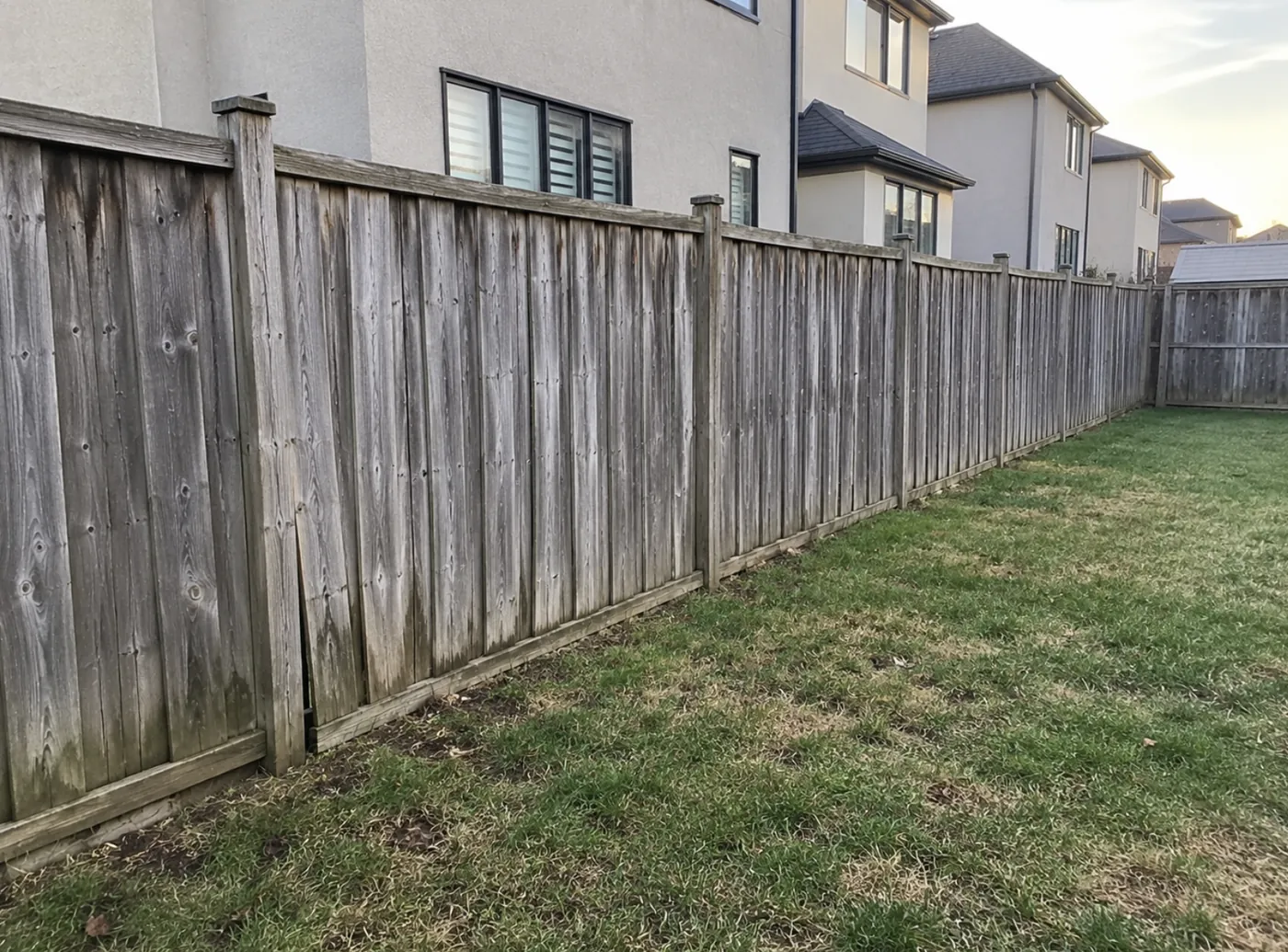 The old weathered wood fence on the same line in Milton before replacement