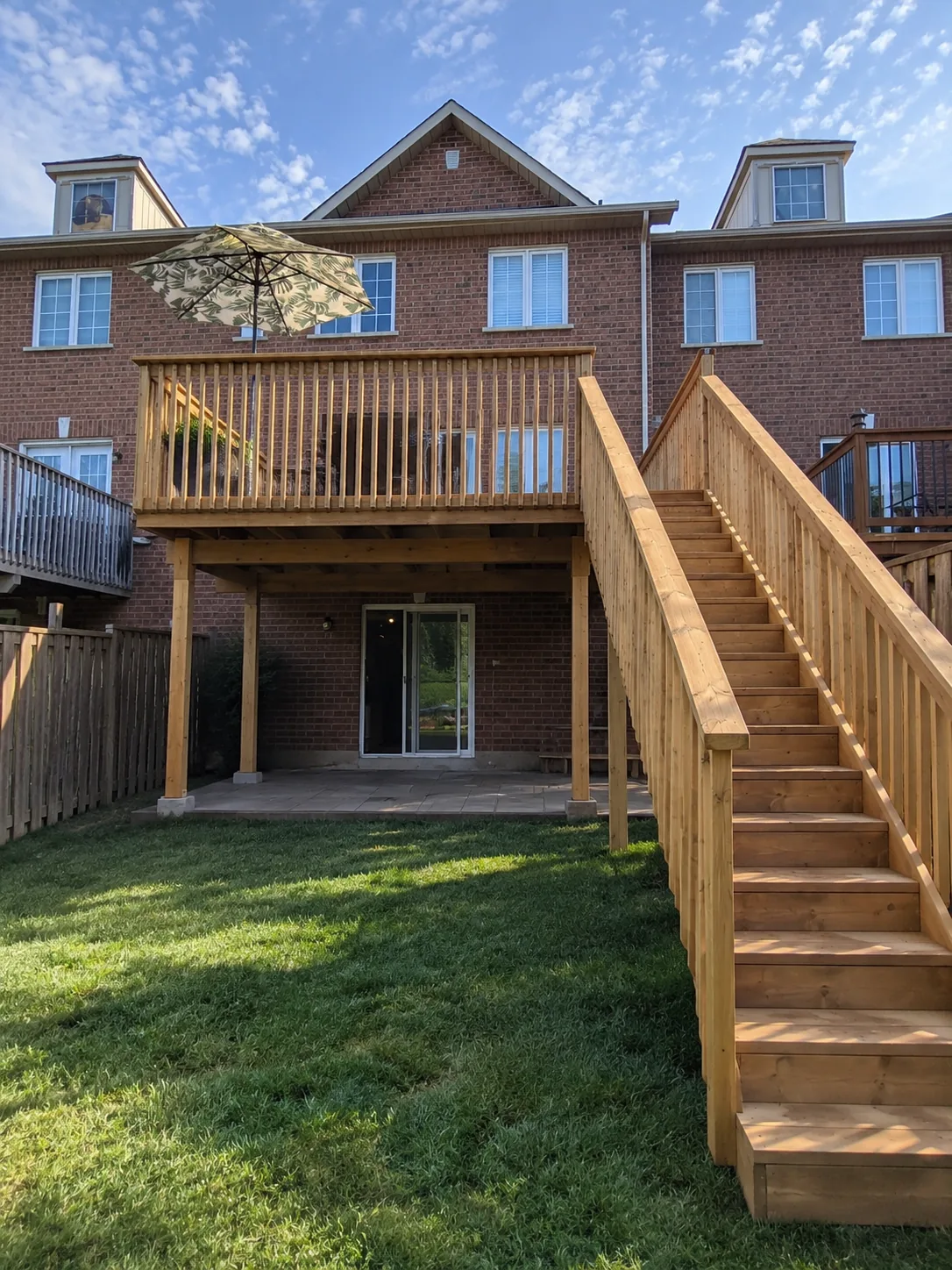 The finished second level deck, stairs and ground floor walkout in Mississauga
