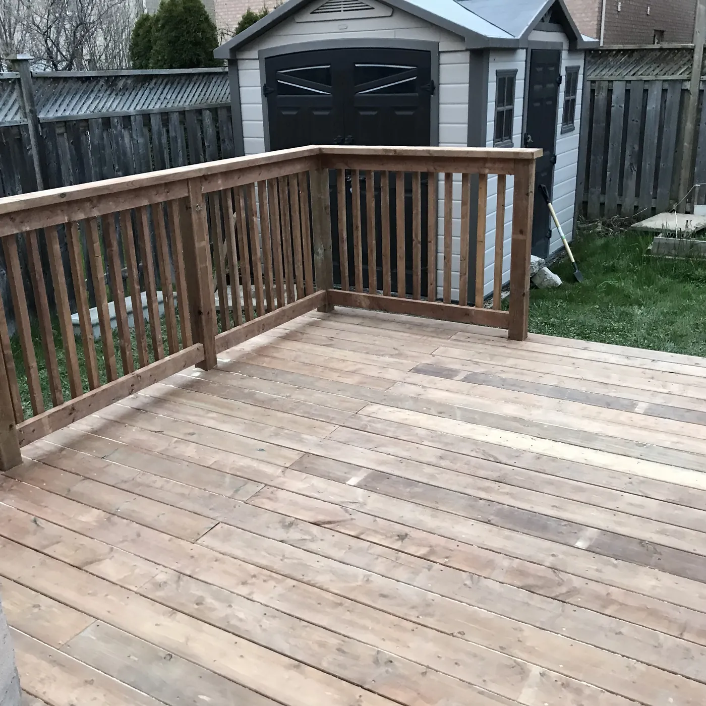 Looking along the deck railing toward the garden shed, Newmarket