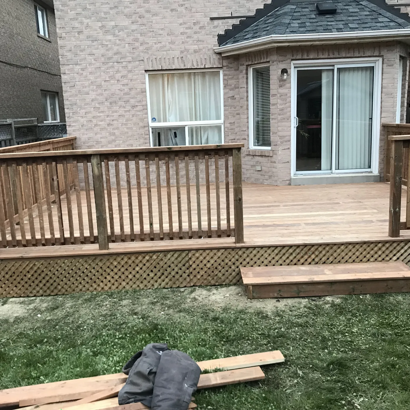 Pressure-treated deck and railing seen from the lawn, Newmarket