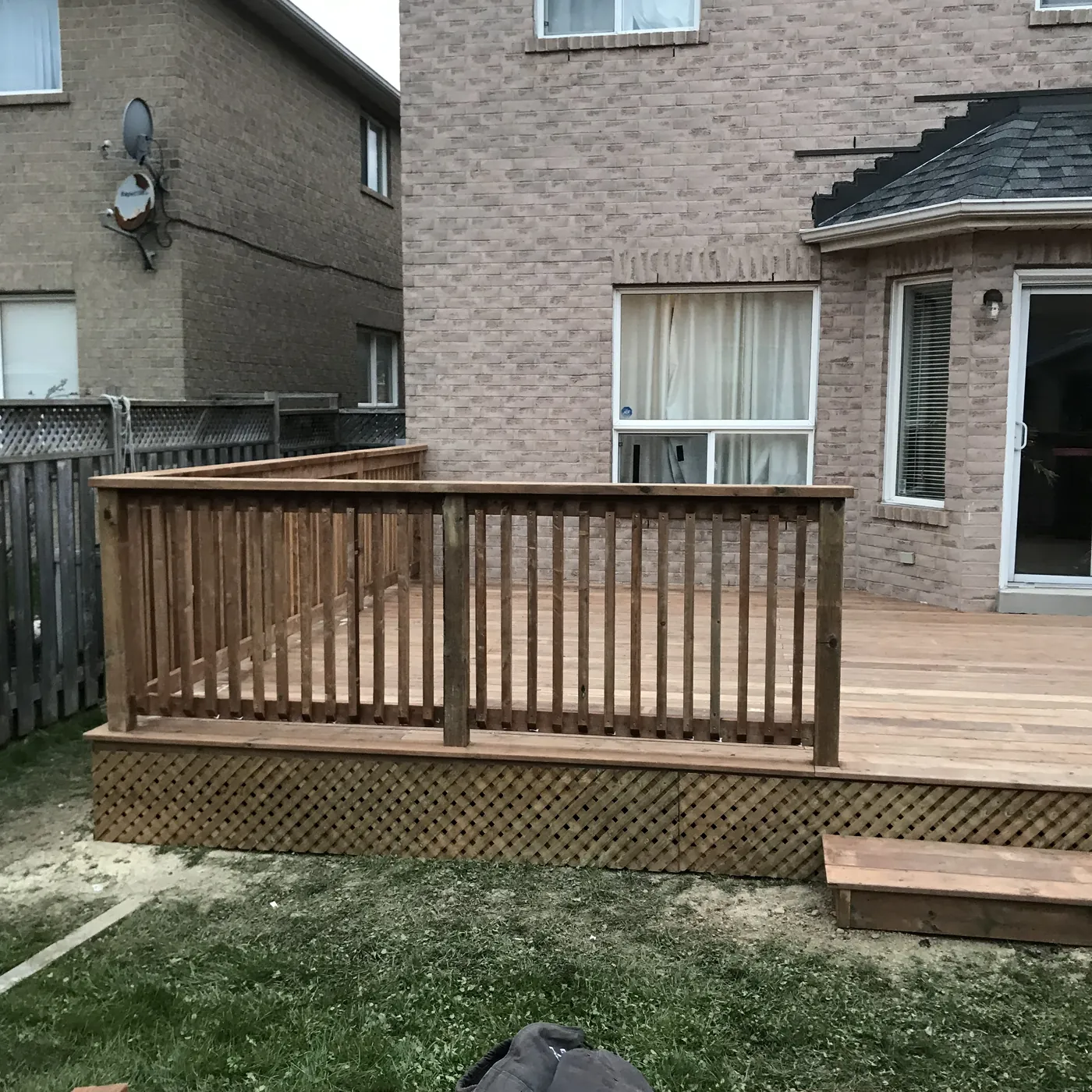 The finished deck along the back of the brick house, Newmarket