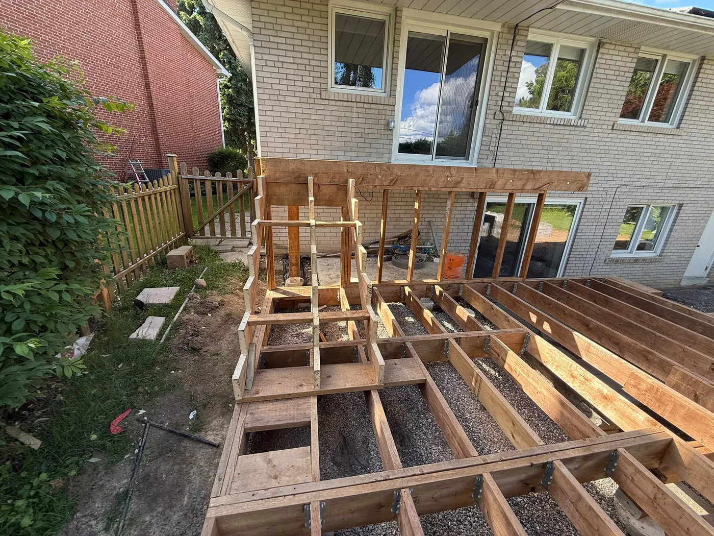 Deck framing and stair structure built around the swim spa in North York