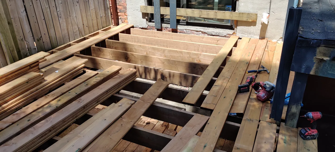 Joists and ledger in place before the deck boards went down in North York