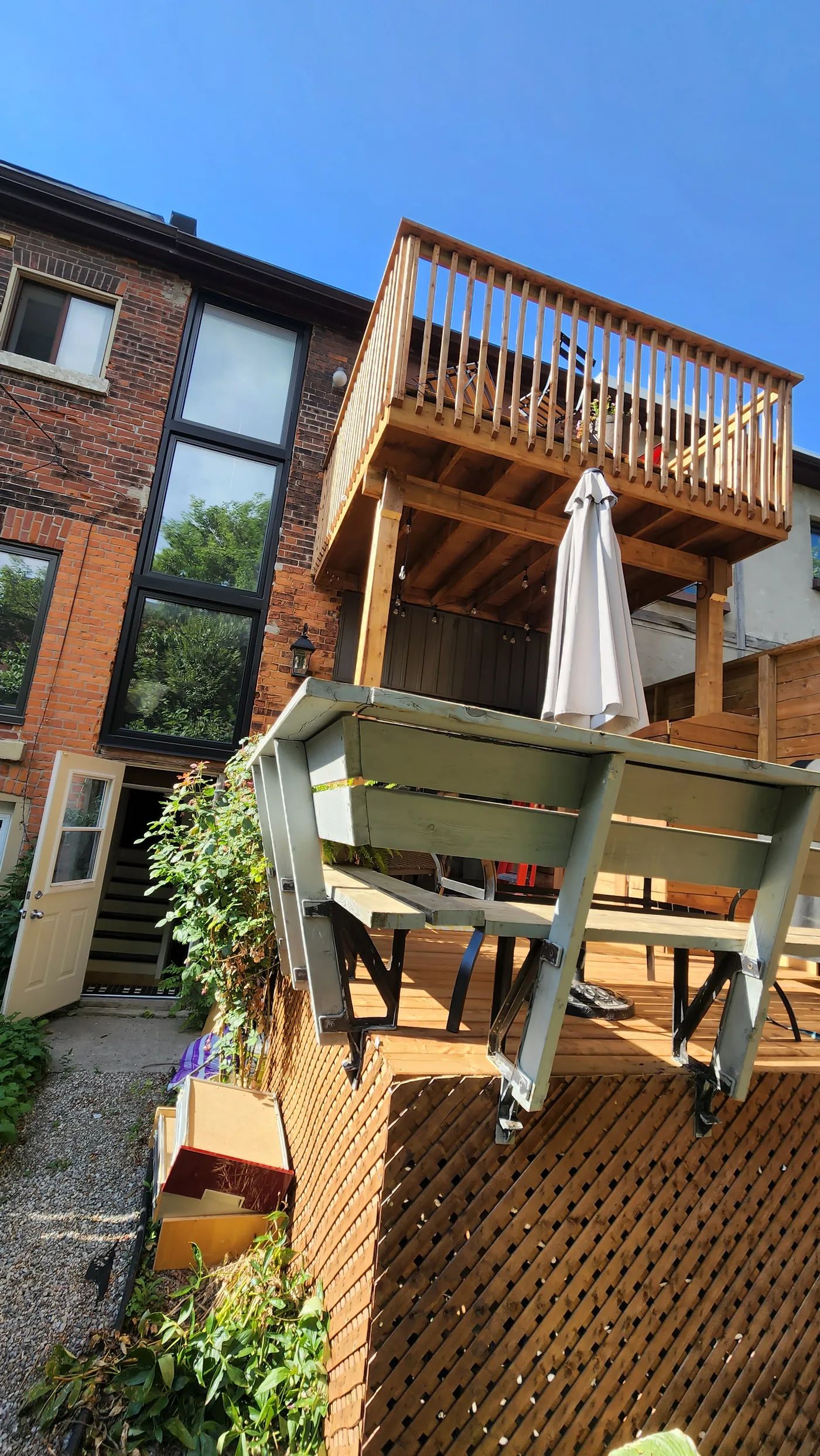 Lower deck sheltered by the waterproofed floor of the deck above in North York