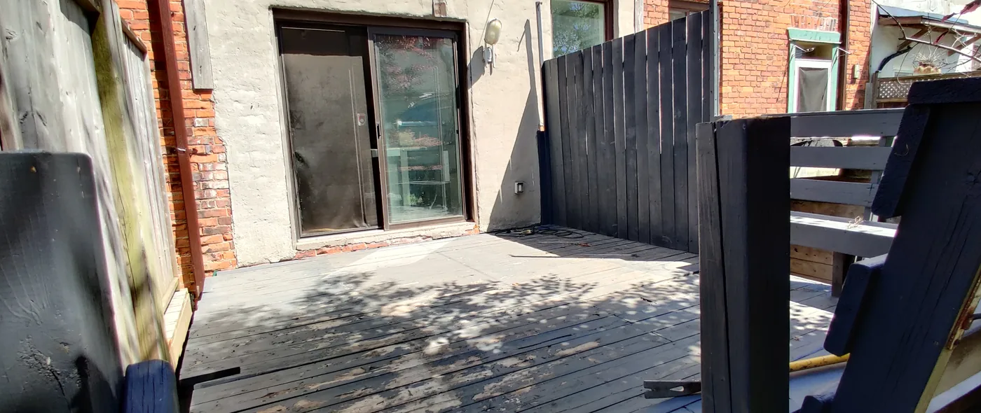 Weathered boards and old railings on the 25 year old North York deck