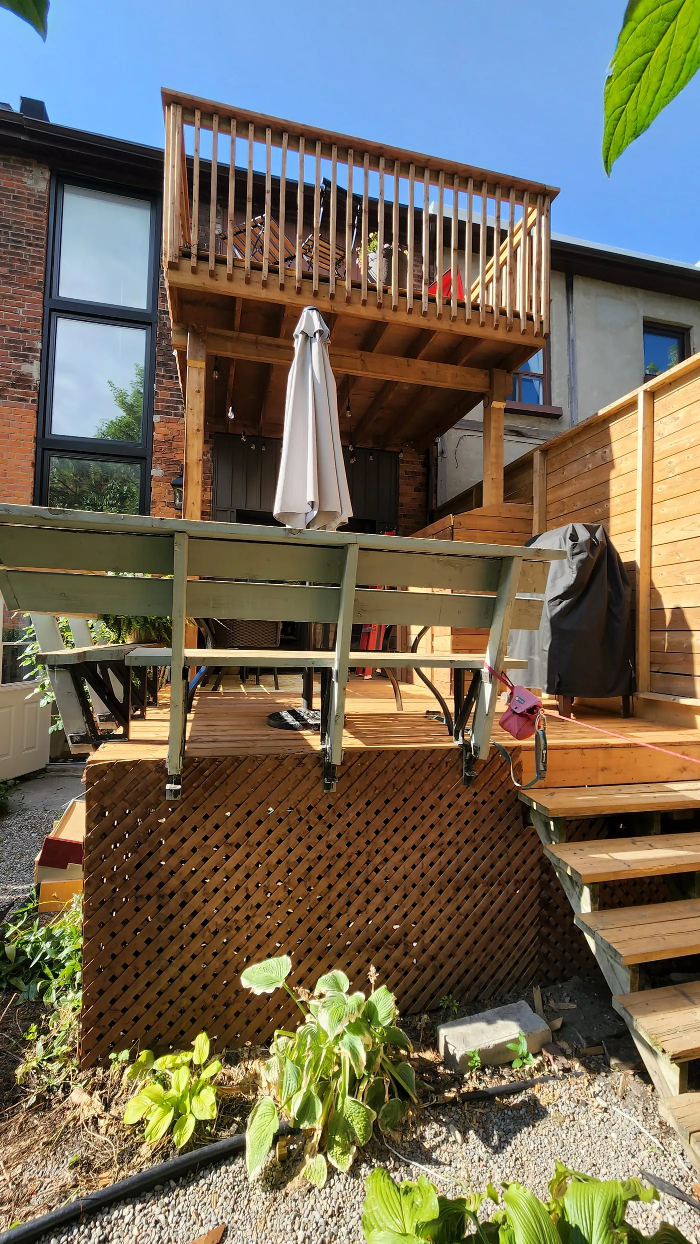 Two-level pressure-treated deck on the back of a North York home