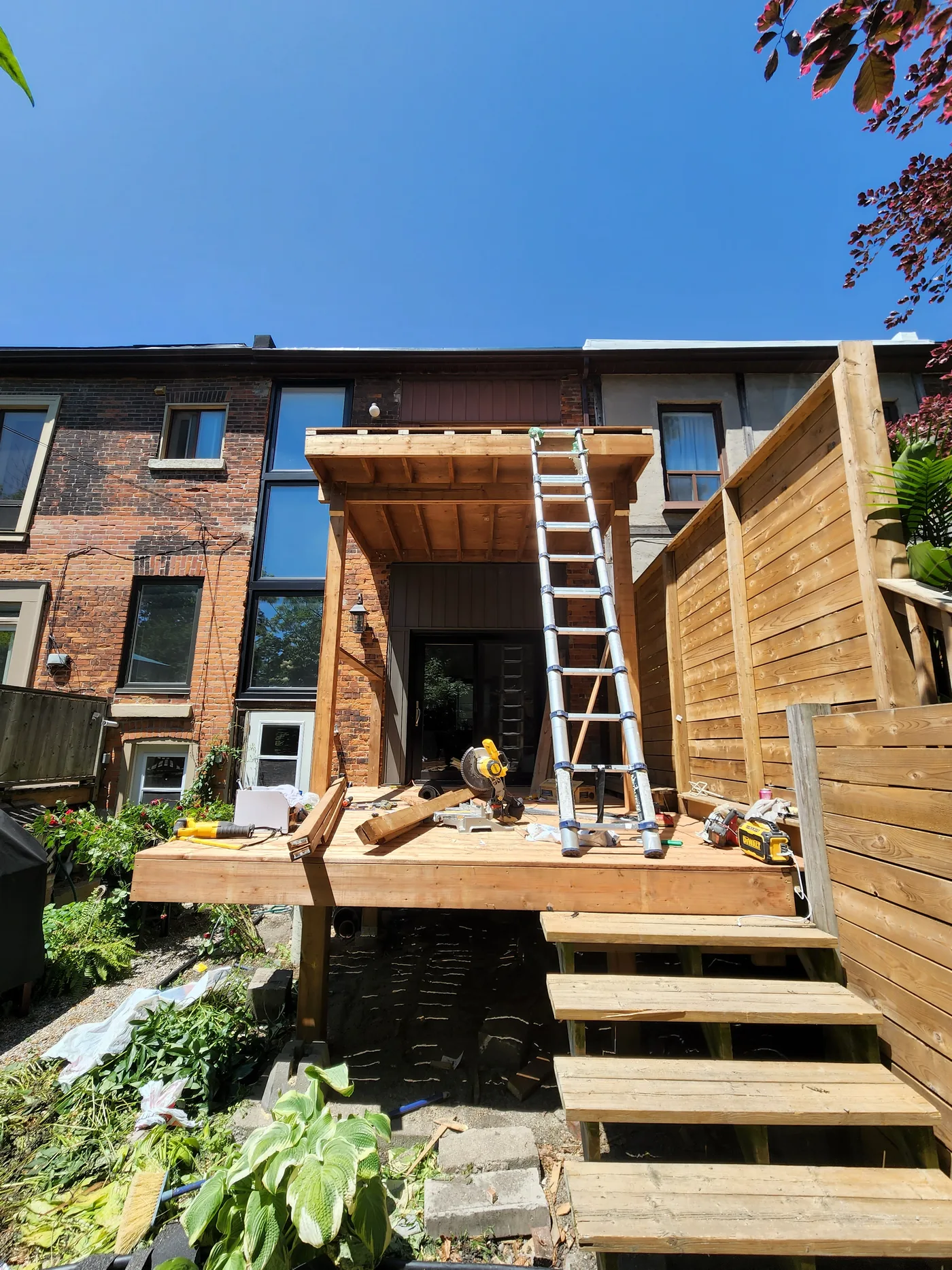 New framing going up for the rebuilt two-level deck in North York