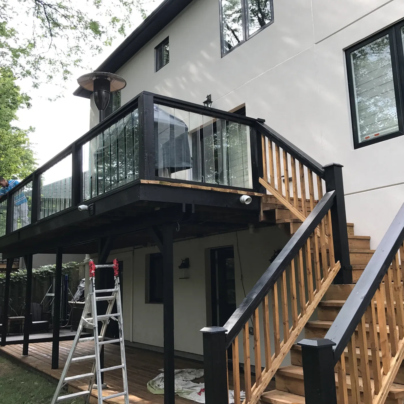Glass railing and cedar stairs on the raised Oakville deck