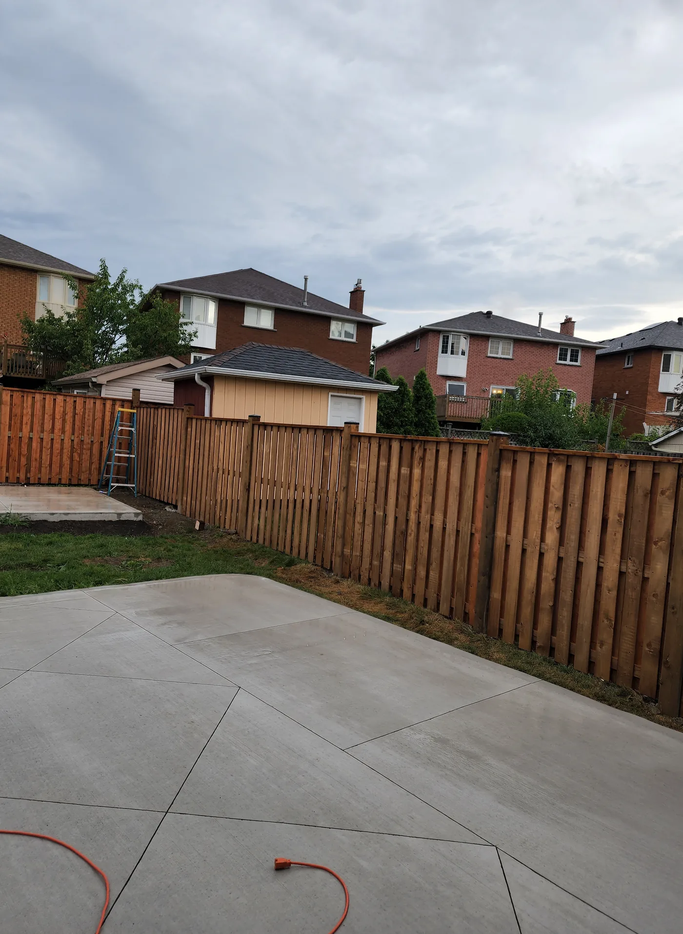 Six foot board privacy fence along the rear property line in Richmond Hill