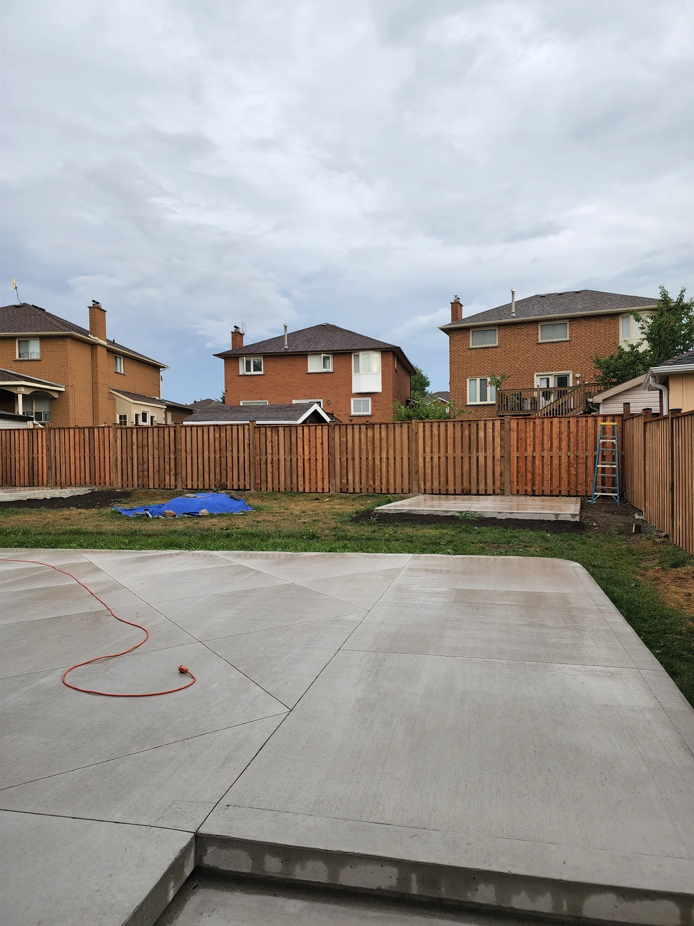 New fence turning the corner of the Richmond Hill backyard