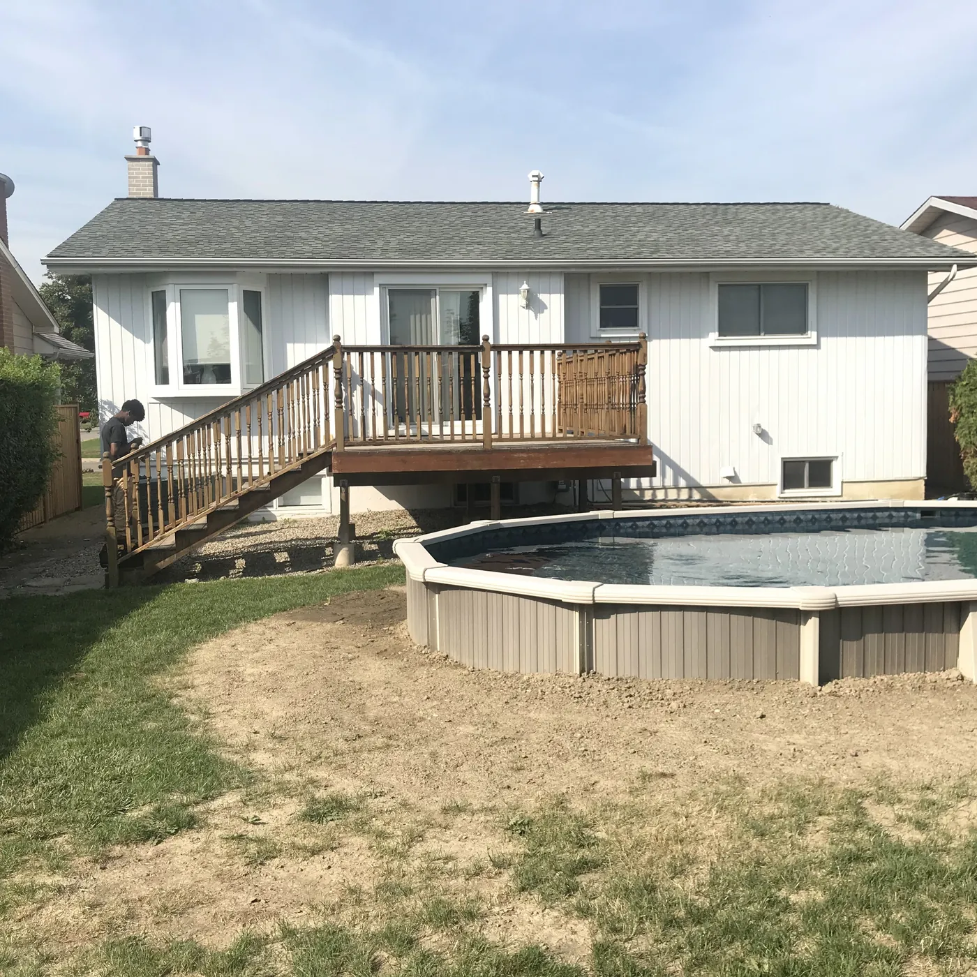 The yard before the deck, with the above-ground pool standing on bare ground, Richmond Hill