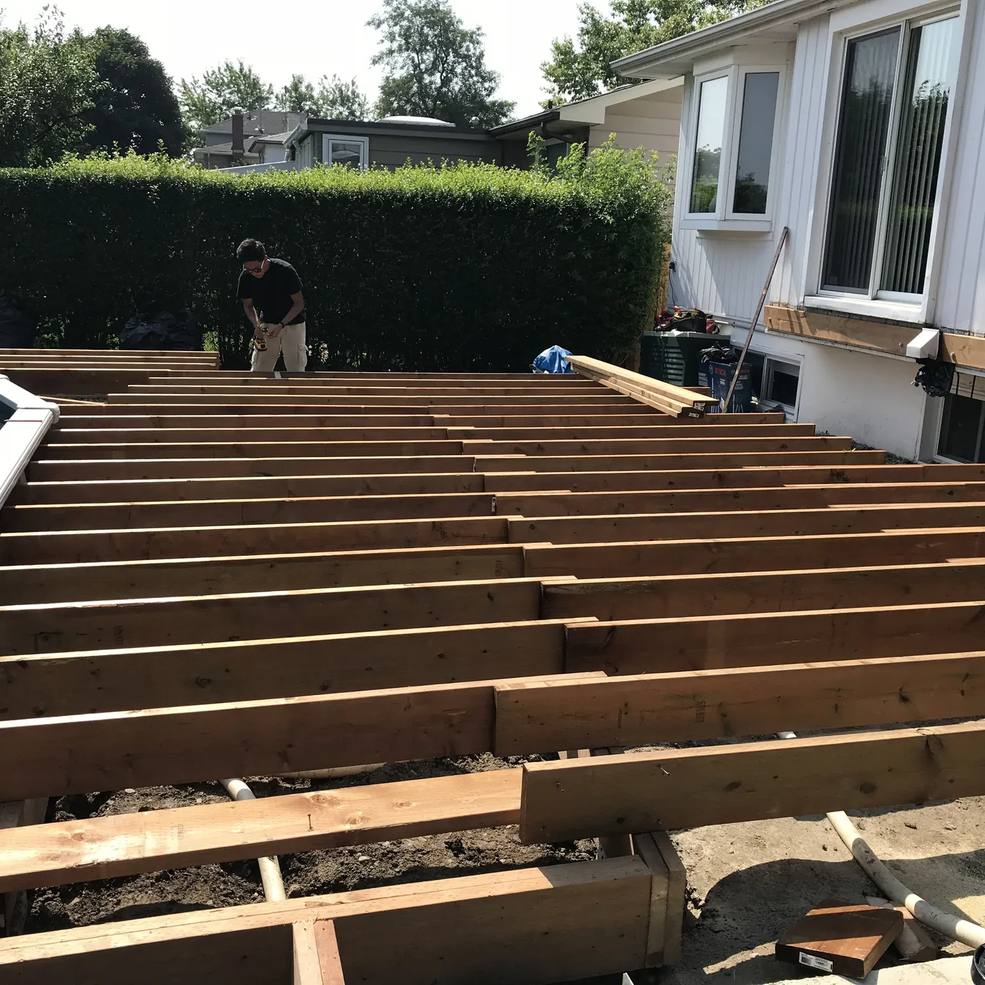 Deck boards going down over the new frame, Richmond Hill
