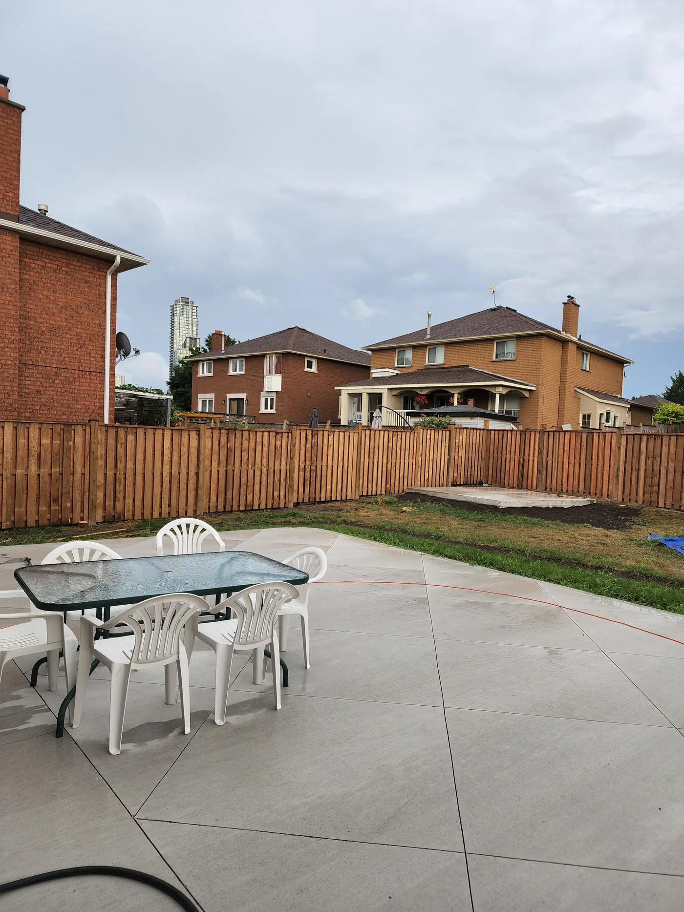 New 6 ft pressure-treated privacy fence around a Richmond Hill backyard patio