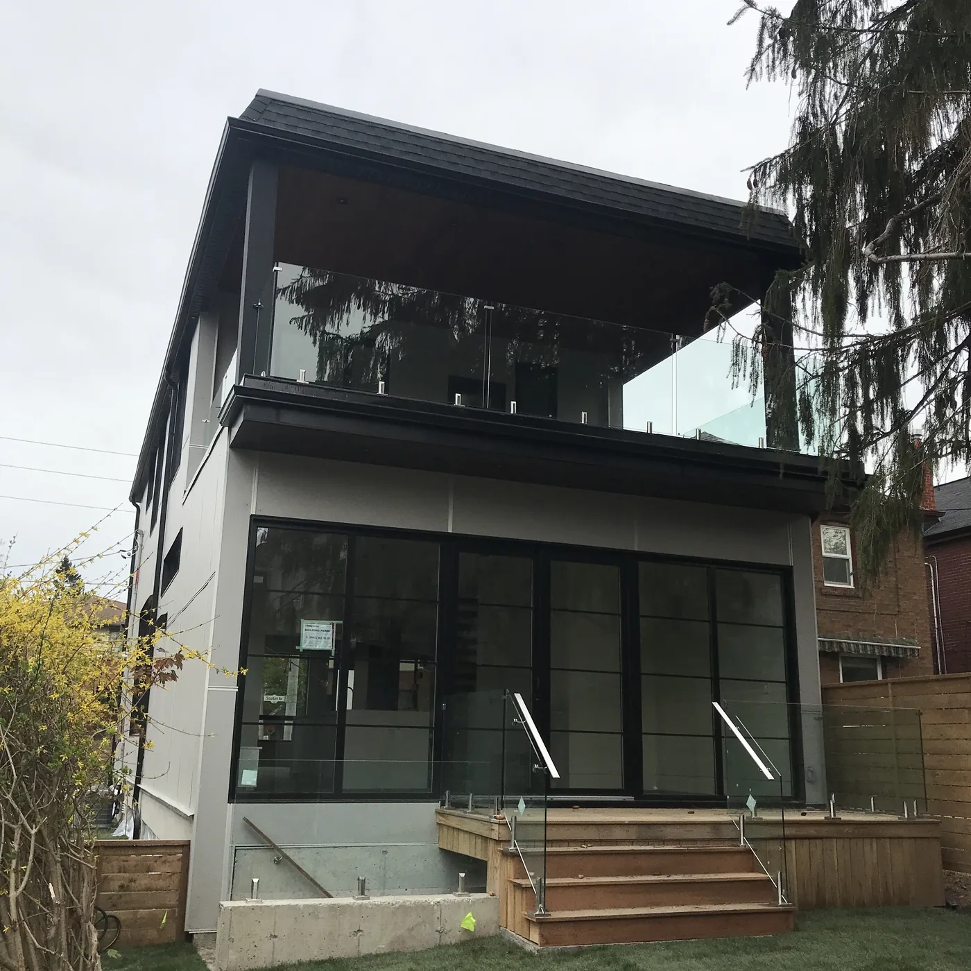 The cedar deck and glass balcony seen from the front, Scarborough