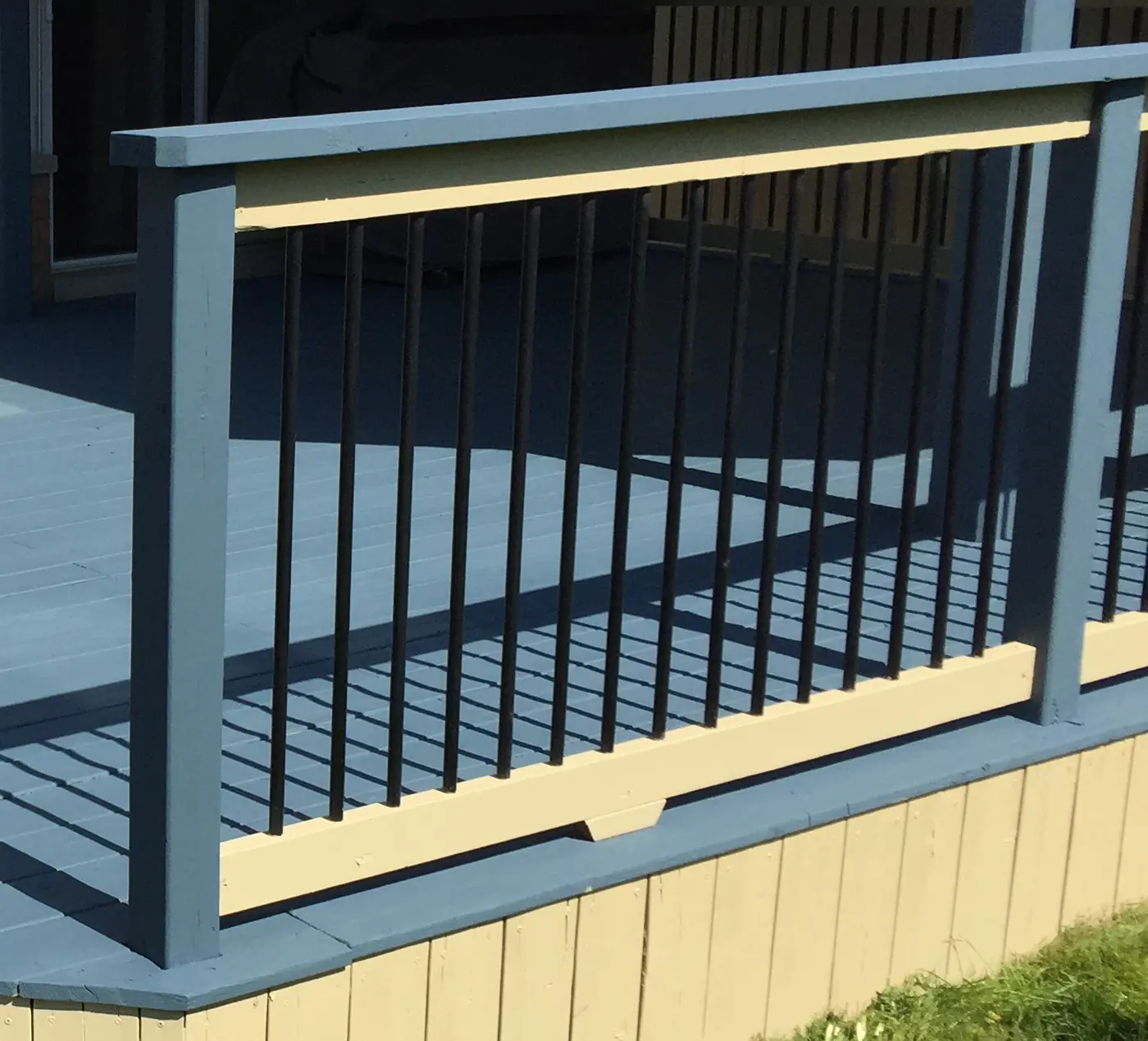 Rebuilt deck railing with new posts, top rail and black metal pickets, Stouffville