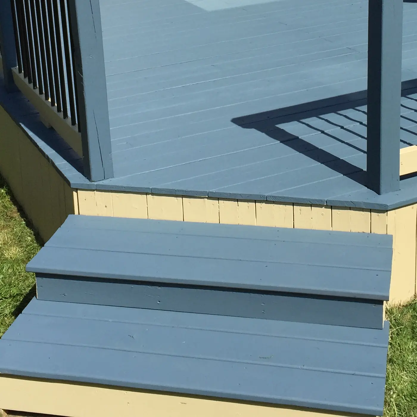 Wide deck steps and the repainted deck surface above them, Stouffville