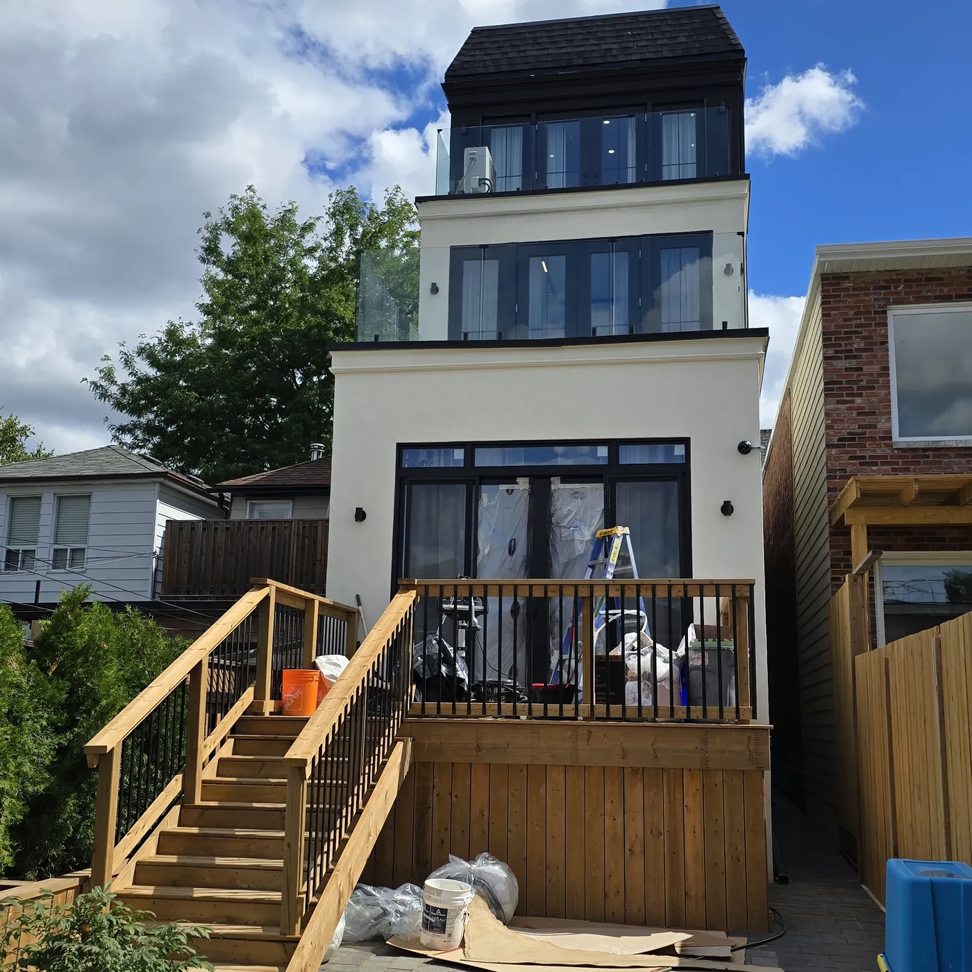 Wide stairs from the deck down to the paved patio, Toronto