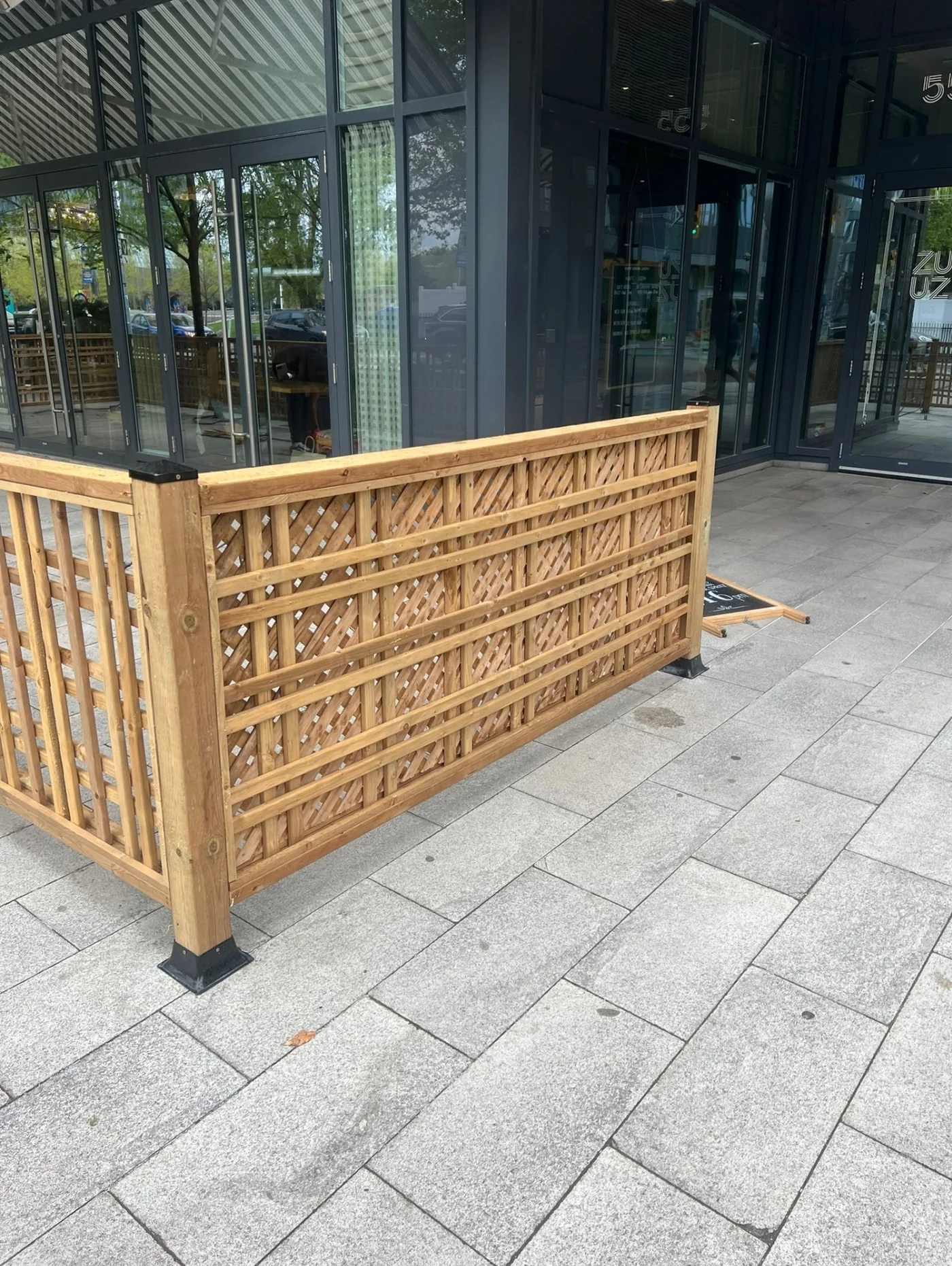 Lattice patio screen turning the corner at the restaurant entrance in Toronto