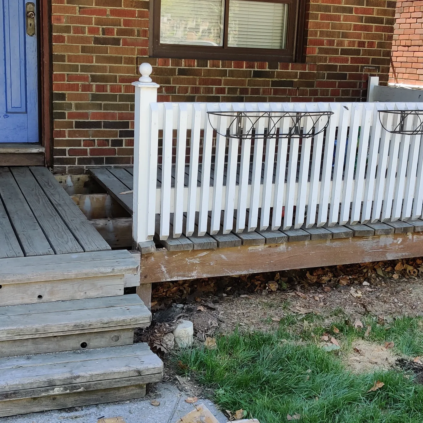 The old porch deck and white picket railing before the rebuild, Toronto