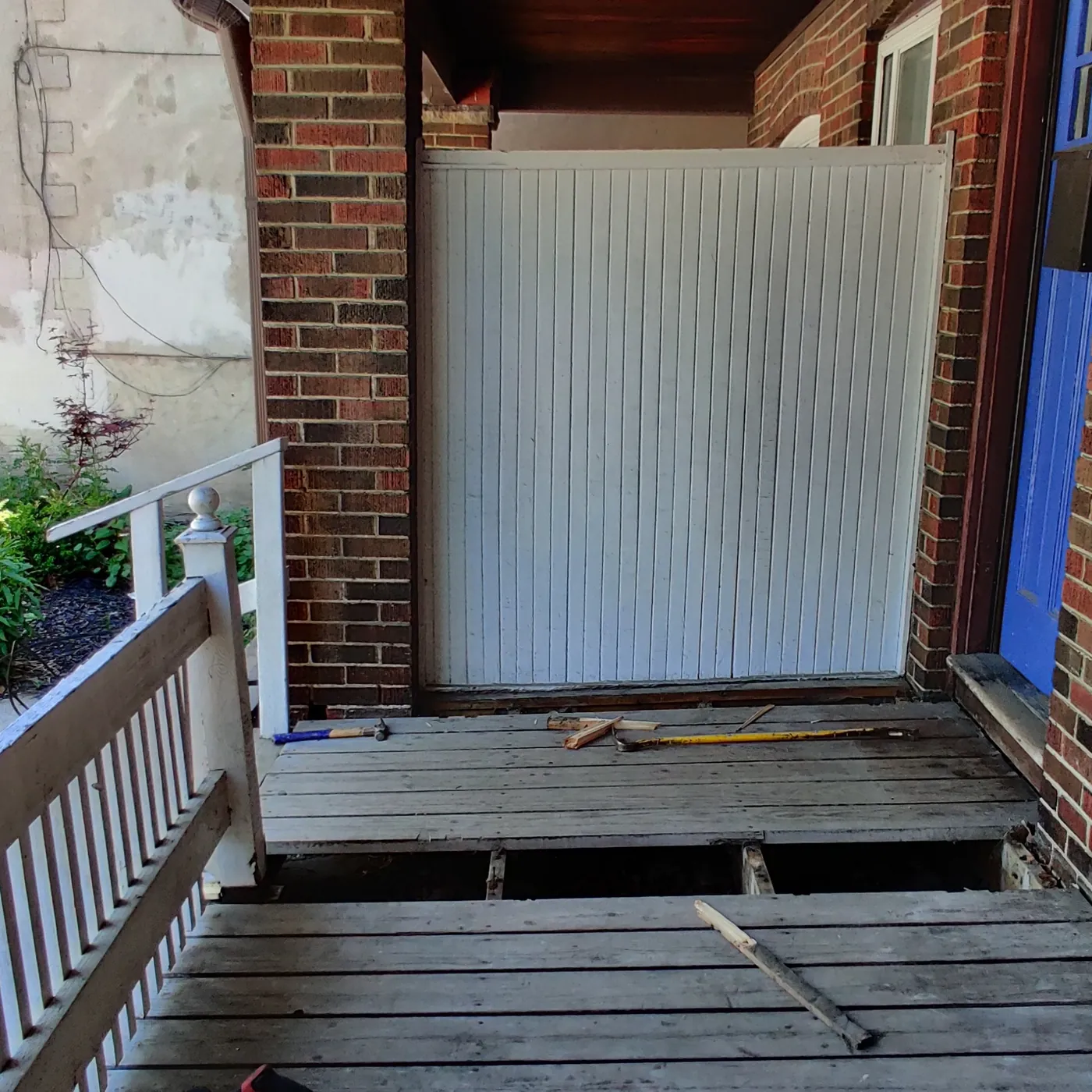 Old porch decking stripped off down to the frame, Toronto