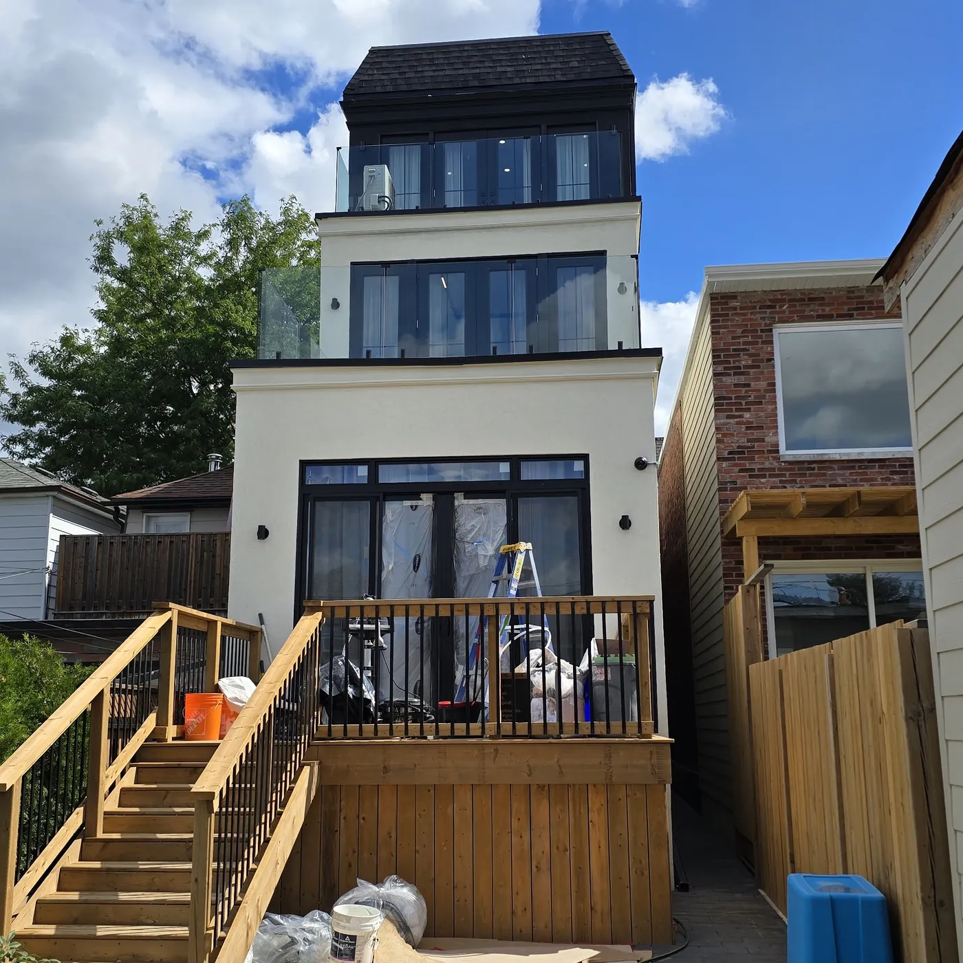 Raised deck and black metal railing off the main floor, Toronto