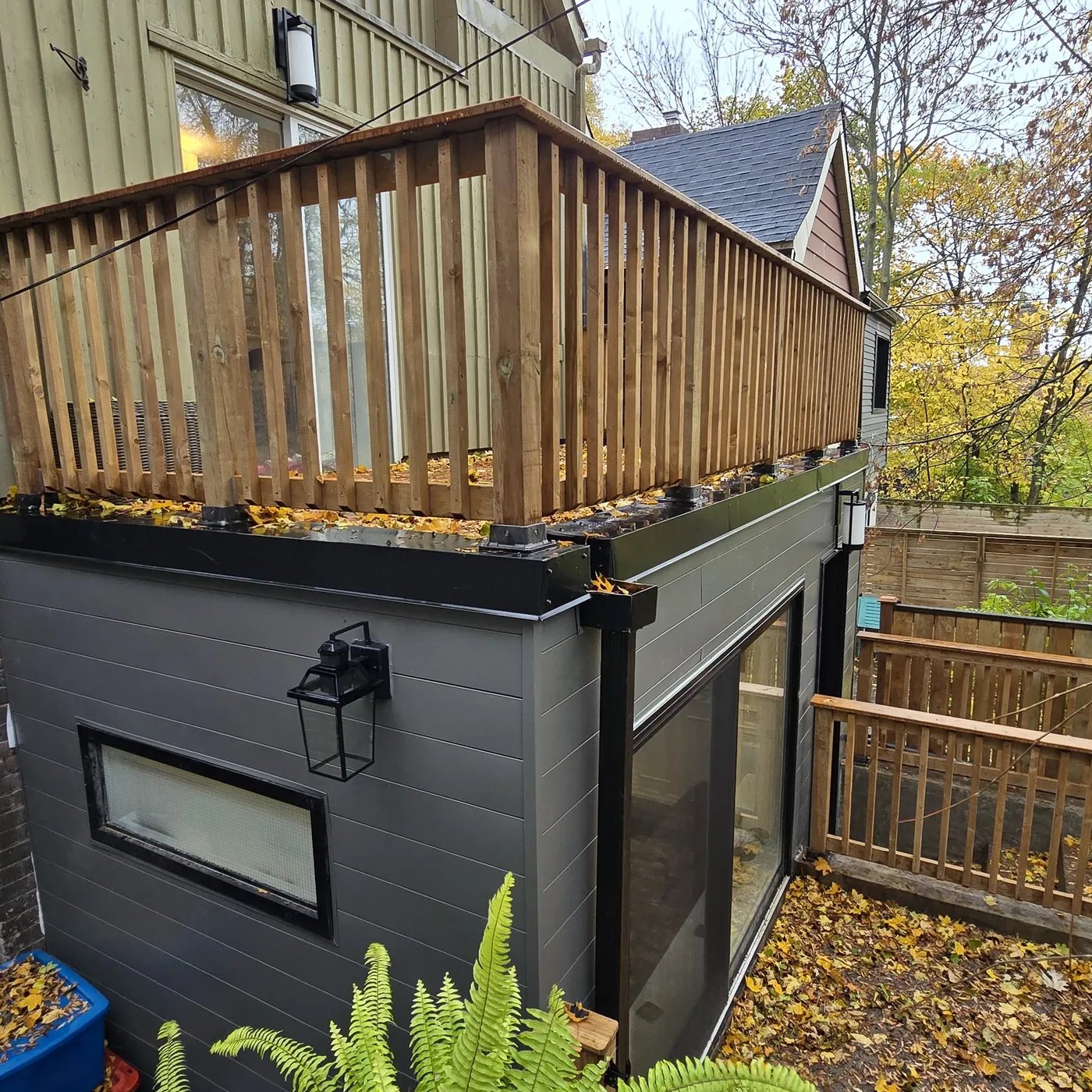 The roof deck seen from the garden with the extension below, Toronto