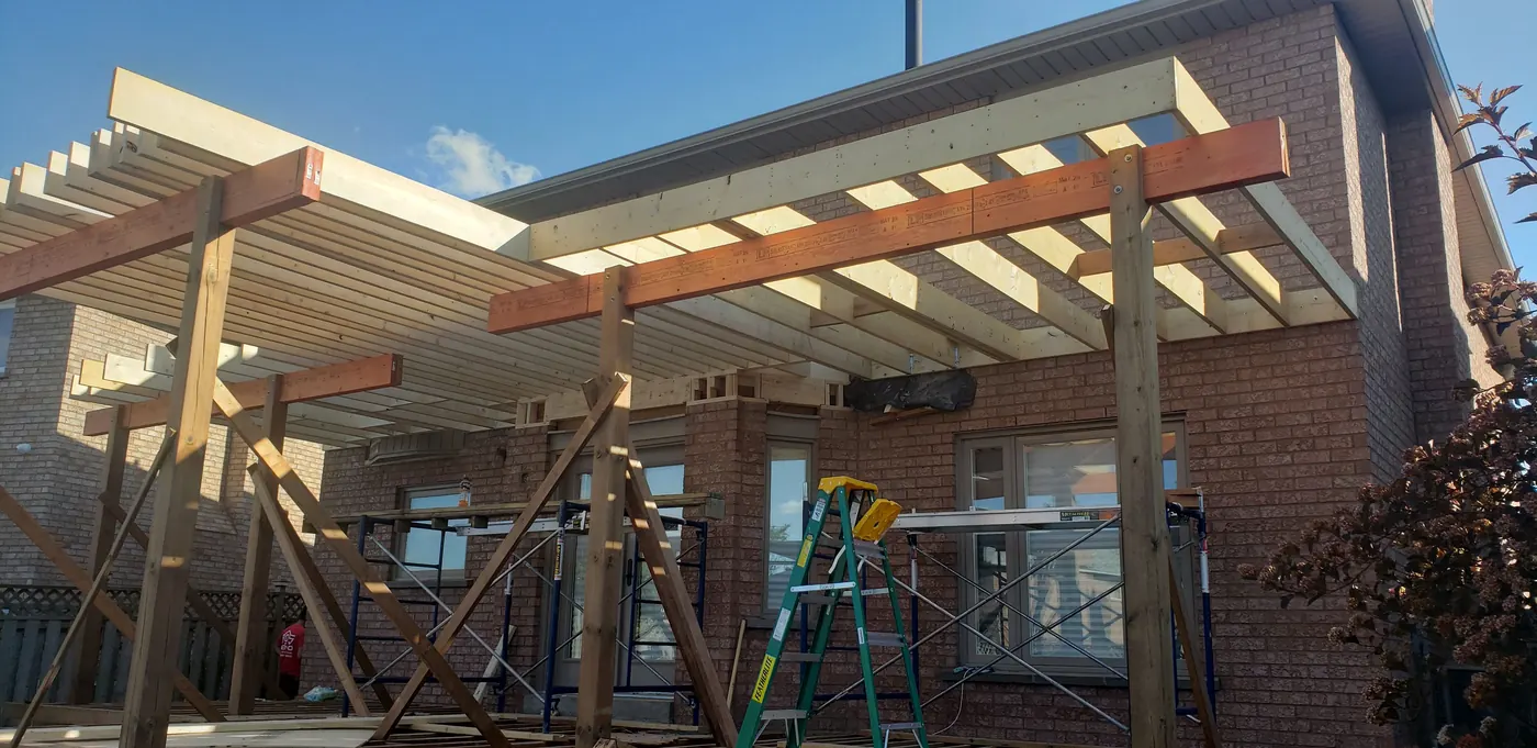Roof beams and rafters framed over a deck in Vaughan