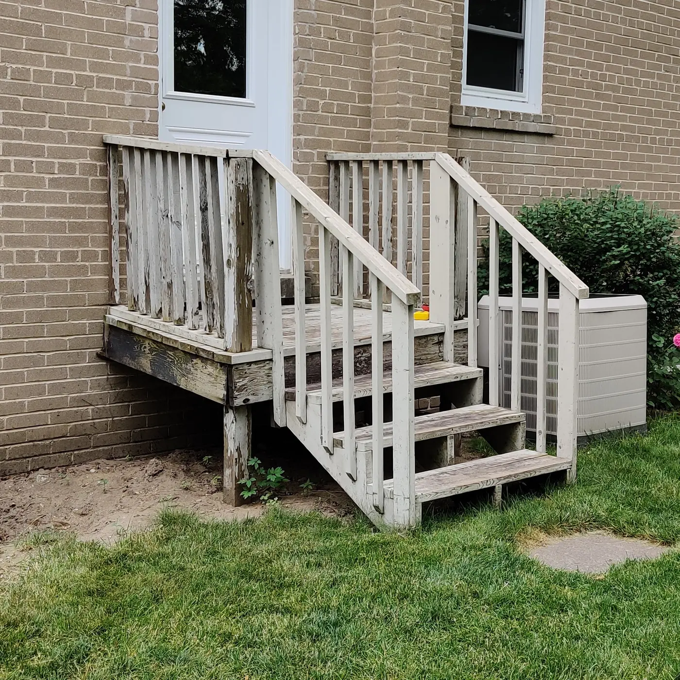 The old painted deck and stairs before the rebuild, rotted through at the base, Whitby