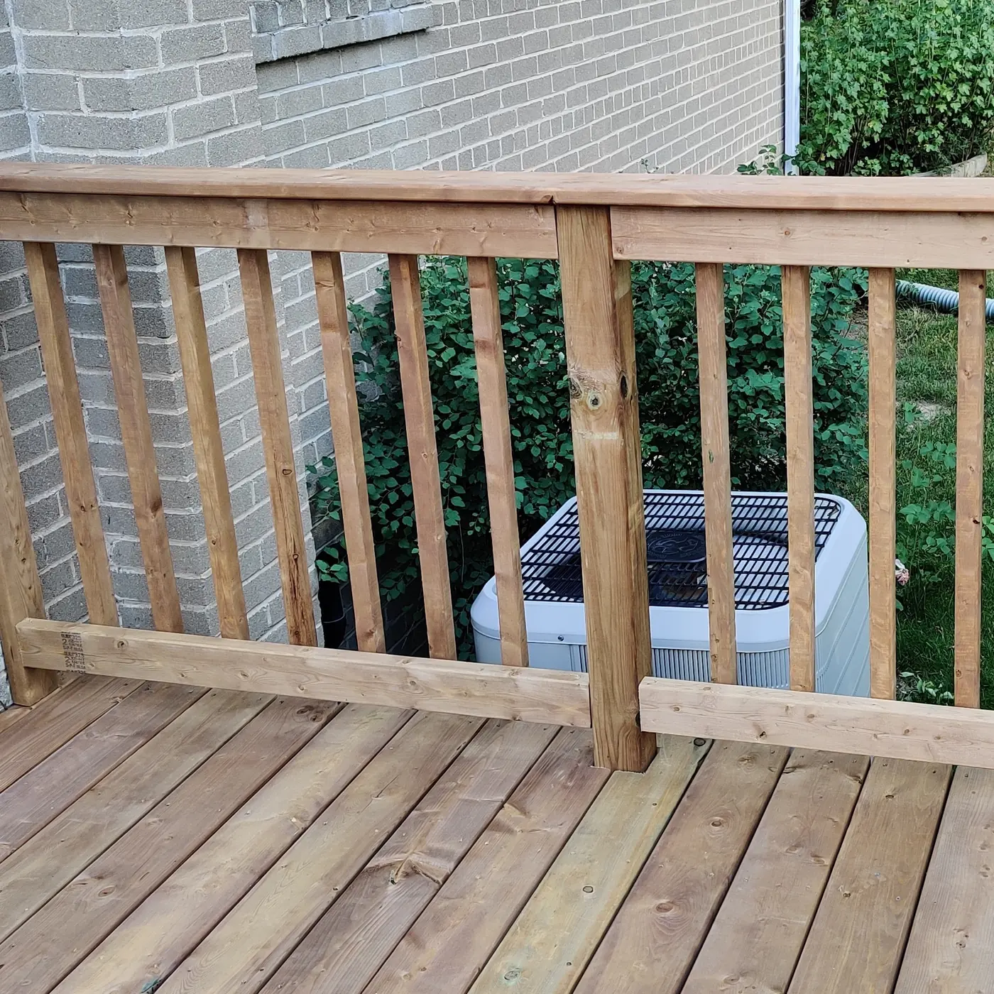 Pressure-treated railing and new deck boards on the rebuilt Whitby deck